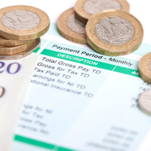 Payslips with some pound coins